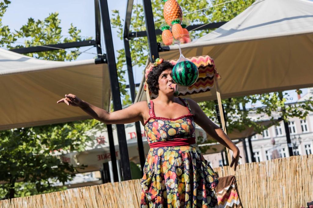 Busker Paine Santamaria during a street circus show