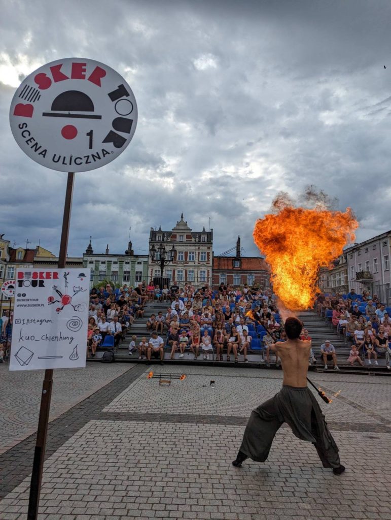 Street performer Kuo Chien Hung 0 fire breathing at Busker Tour in Krotoszyn