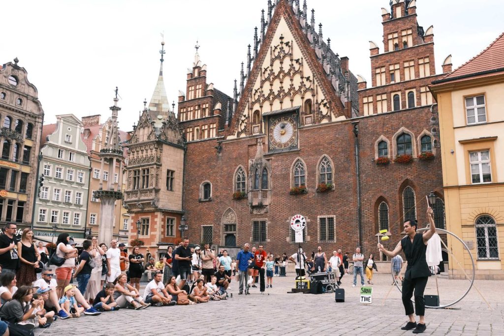 Diabolo and Cyr wheel artist Alvin Yong performing at street festival Busker Tour in Wrocław