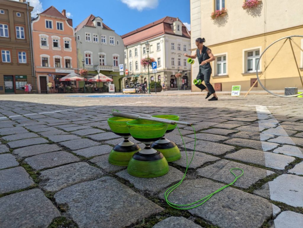 A street performer doing tricks with circus prop diabolo